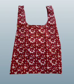 Floral print bag against blue background